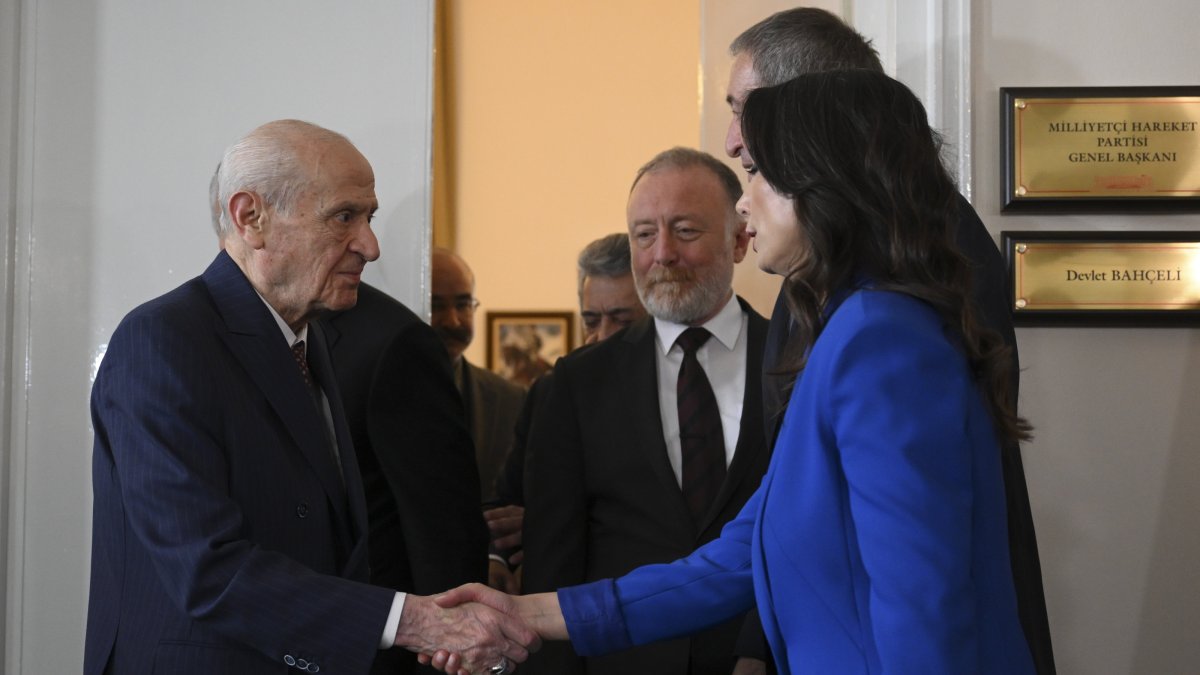 MHP leader Devlet Bahçeli (L) shakes hands with DEM Party co-chair Tülay Hatimoğulları, Ankara, Türkiye, May 27, 2025. (AA Photo)