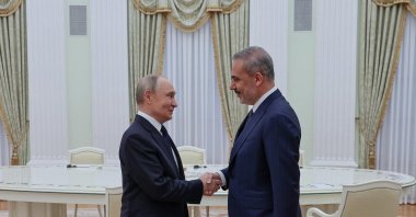 Russian President Vladimir Putin (L) meets with Foreign Minister Hakan Fidan at the Kremlin, Moscow, Russia, May 26, 2025. (Turkish Foreign Ministry Handout via AFP Photo)