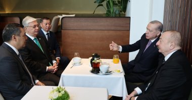 President Recep Tayyip Erdoğan gestures as he meets with Kazakh President Kassym-Jomart Tokayev (2-L) and Azerbaijani President Ilham Aliyev (R) during the informal summit of the Organization of Turkic States (OTS), Budapest, Hungary, May 21, 2025. (AA Photo)