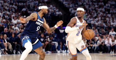 Oklahoma City Thunder&#039;s Shai Gilgeous-Alexander (R) drives to the basket against Nickeil Alexander-Walker during the third quarter in Game Four of the Western Conference Finals of the 2025 NBA Playoffs, Minneapolis, U.S., May 26, 2025. (AFP Photo)
