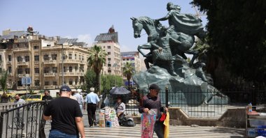 People walk in central Damascus, Syria, May 14, 2025.  (EPA Photo)