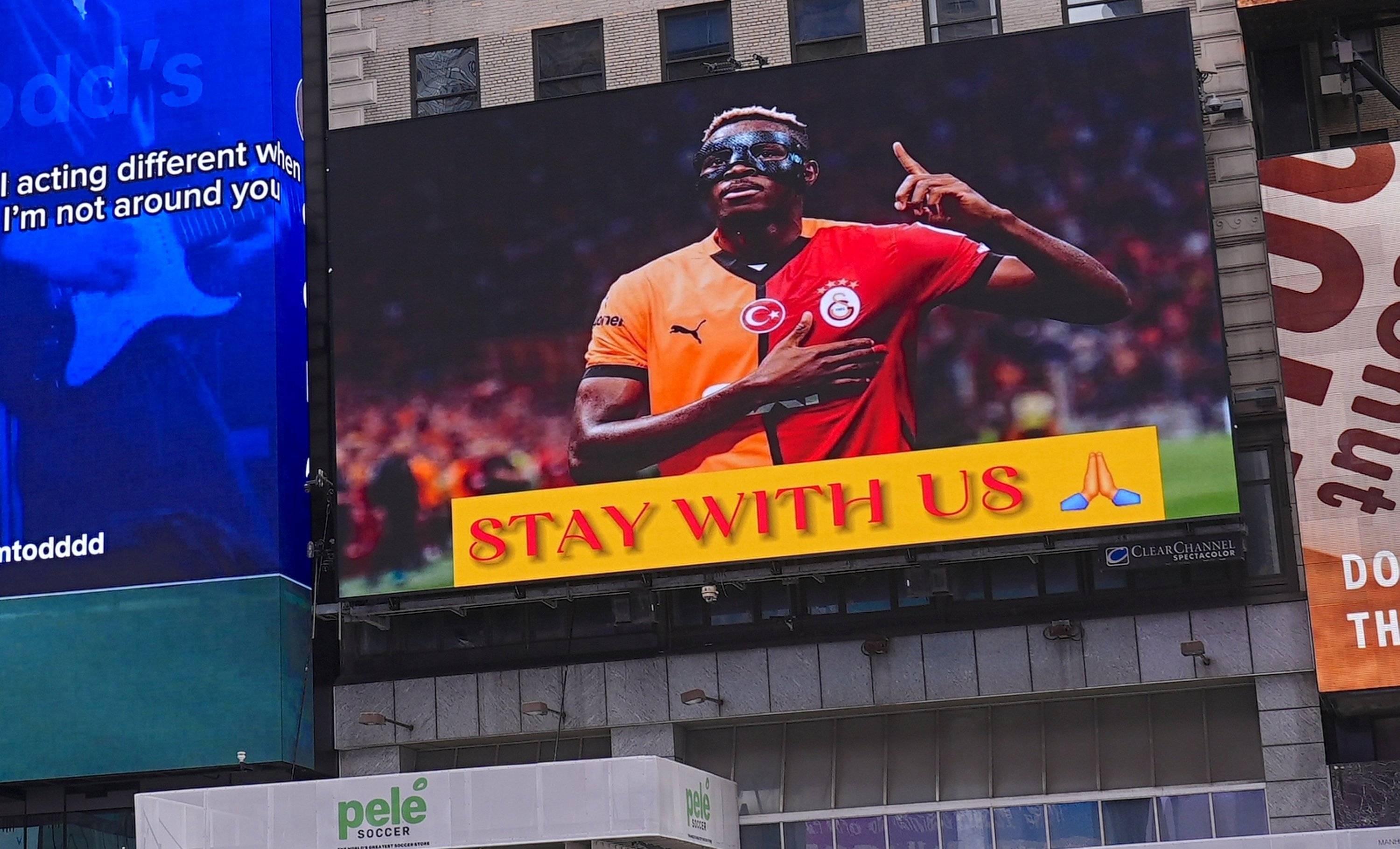 A screen shows a 'Stay With Us' message from Galatasaray fans aimed toward Victor Osimhen during the clubs 25th Süper Lig title celebrations, Istanbul, Türkiye, May 25, 2025. (AA Photo)