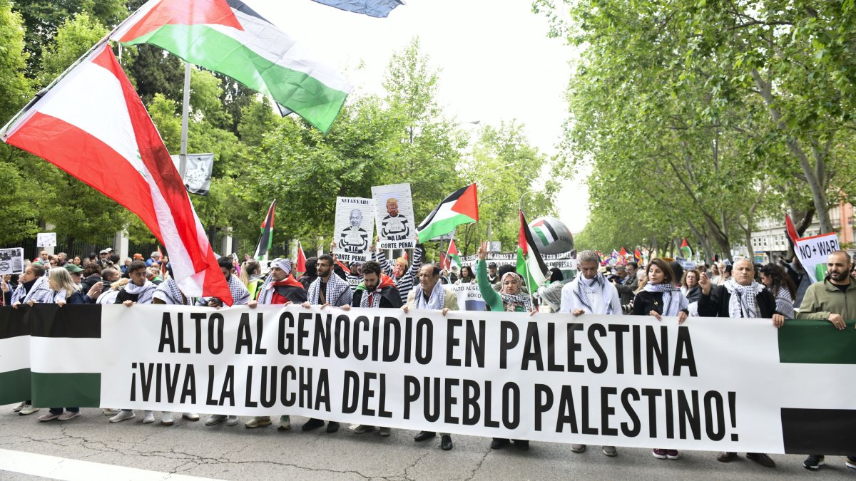 Protesters hold a banner reading &#039;Stop the Genocide in Palestine. Long live the struggle of the Palestinian people&#039; during a pro-Palestinian rally to protest against the arms trade with Israel, in Madrid, Spain, May 10, 2025. (EPA Photo)