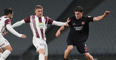 Undated photo of Fatih Karagümrük&#039;s Ömer Ersoy (R) challenges Bandırmaspor Levent Ayçiçek during the 1. Lig match, Balıkesir, Türkiye. (IHA Photo)