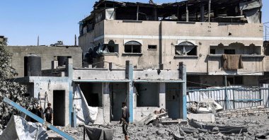 People search through rubble following Israeli bombardment in the Bureij camp for Palestinian refugees in the central Gaza Strip on May 23, 2025. (AFP Photo)