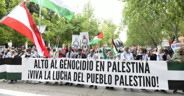 Protesters hold a banner reading &#039;Stop the Genocide in Palestine. Long live the struggle of the Palestinian people&#039; during a pro-Palestinian rally to protest against the arms trade with Israel, in Madrid, Spain, May 10, 2025. (EPA Photo)