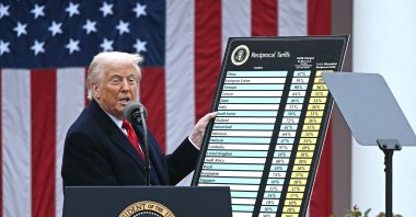 U.S. President Donald Trump holds a chart as he delivers remarks on reciprocal tariffs during an event in the Rose Garden entitled "Make America Wealthy Again" at the White House, Washington, U.S., April 2, 2025. (AFP Photo)