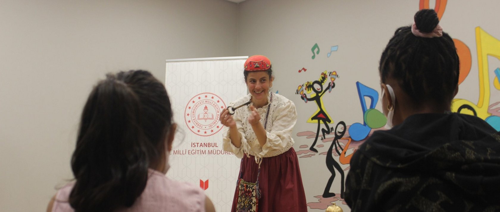 A teacher from the Istanbul Fairy Tale School explains a story to young patients during a Masalhane session, Istanbul, Türkiye, May 22, 2025. (AA Photo)