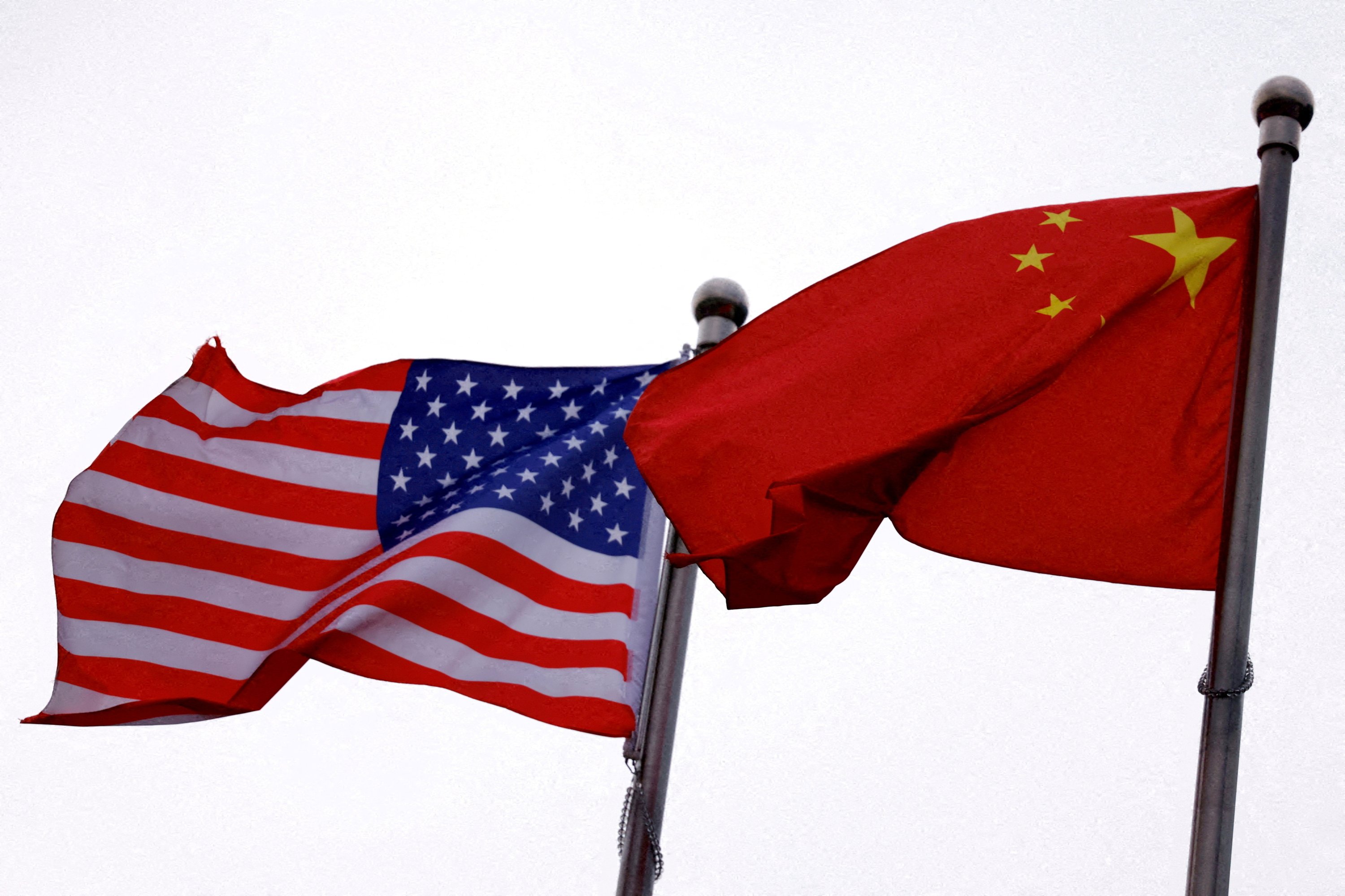 Chinese and U.S. flags flutter outside the building of an American company in Beijing, China, April 8, 2025. (Reuters Photo)