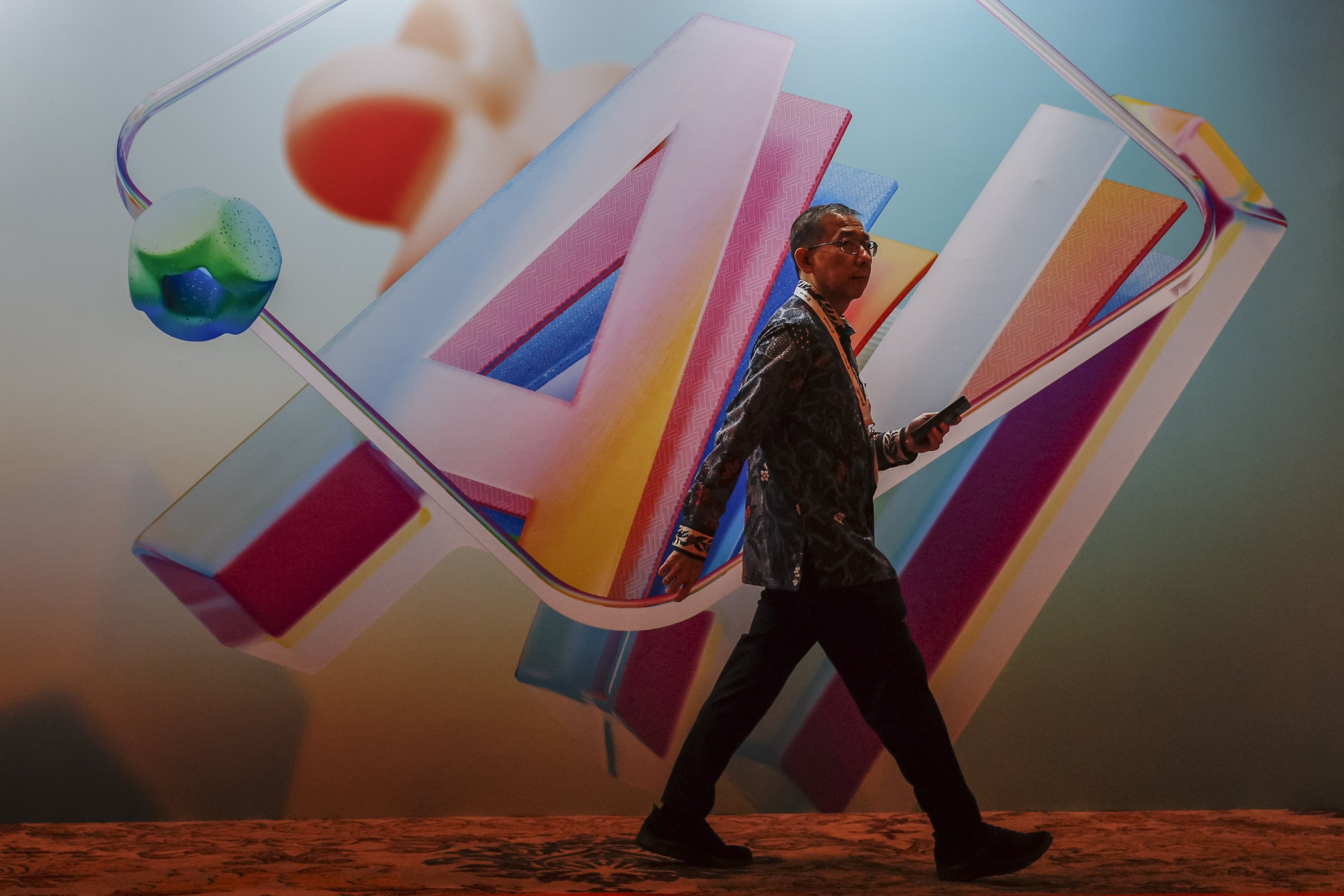 A participant walks in front of an AI banner during the Microsoft AI Tour event, Jakarta, Indonesia, May 27, 2025. (EPA Photo)