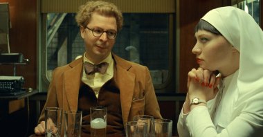 Michael Cera (L) and Mia Threapleton in a scene from &quot;The Phoenician Scheme.&quot; (Focus Features via AP Photo)