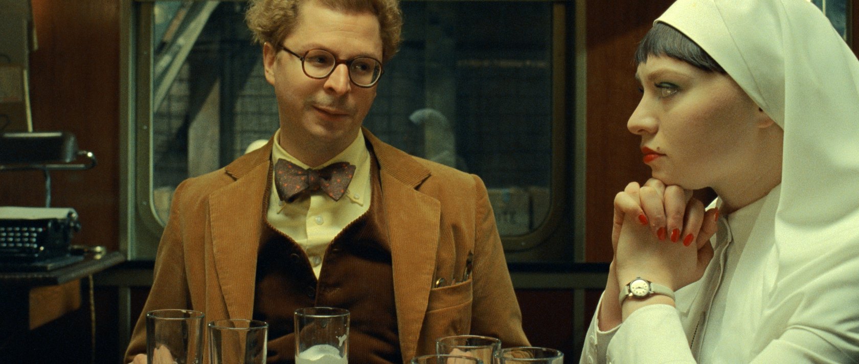 Michael Cera (L) and Mia Threapleton in a scene from &quot;The Phoenician Scheme.&quot; (Focus Features via AP Photo)