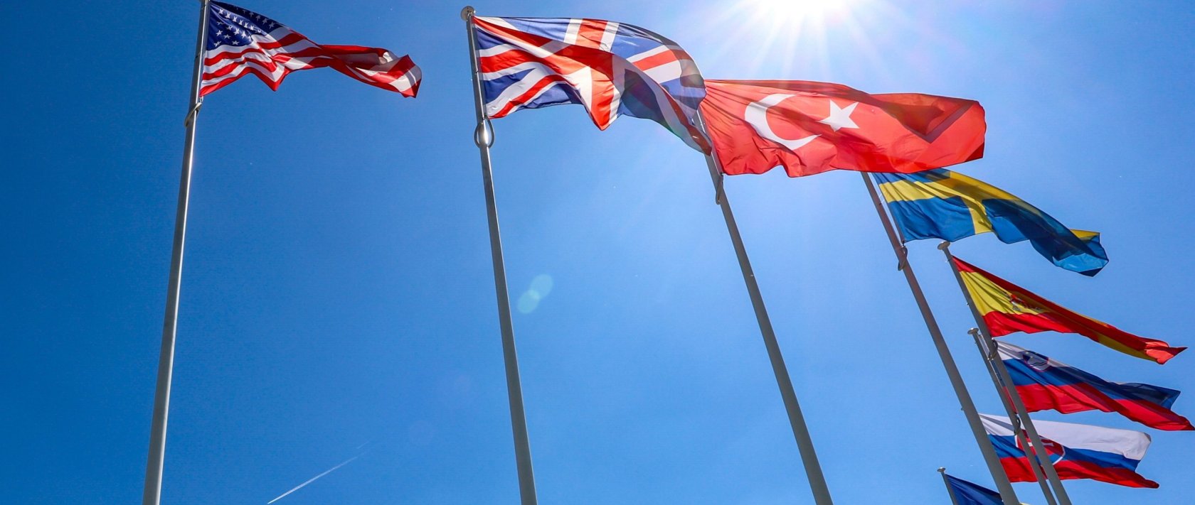 Flags of NATO member countries flutter during a ceremony at NATO headquarters, Brussels, Belgium, April 28, 2025. (EPA Photo)