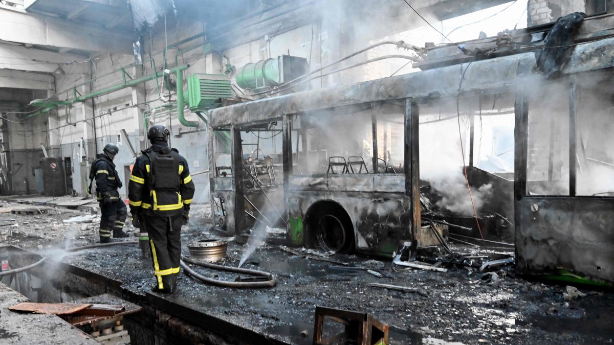 Ukrainian rescuers work to extinguish a fire in a trolleybus depot following a drone strike in Kharkiv, Ukraine, May 30, 2025. (AFP Photo)