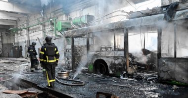 Ukrainian rescuers work to extinguish a fire in a trolleybus depot following a drone strike in Kharkiv, Ukraine, May 30, 2025. (AFP Photo)