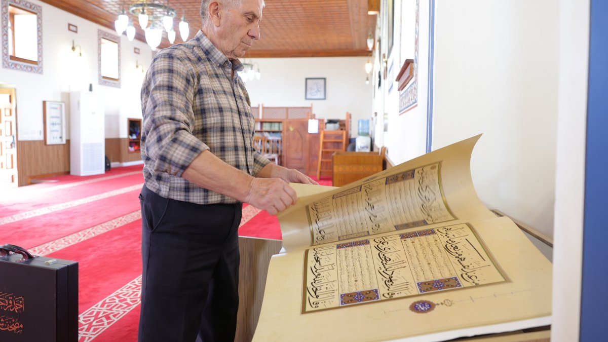 Kasem Hafizi, the mosque&#039;s 78-year-old imam, shows the preserved Quran at the mosque, Tirana, Albania, May 31, 2025. (AA Photo)