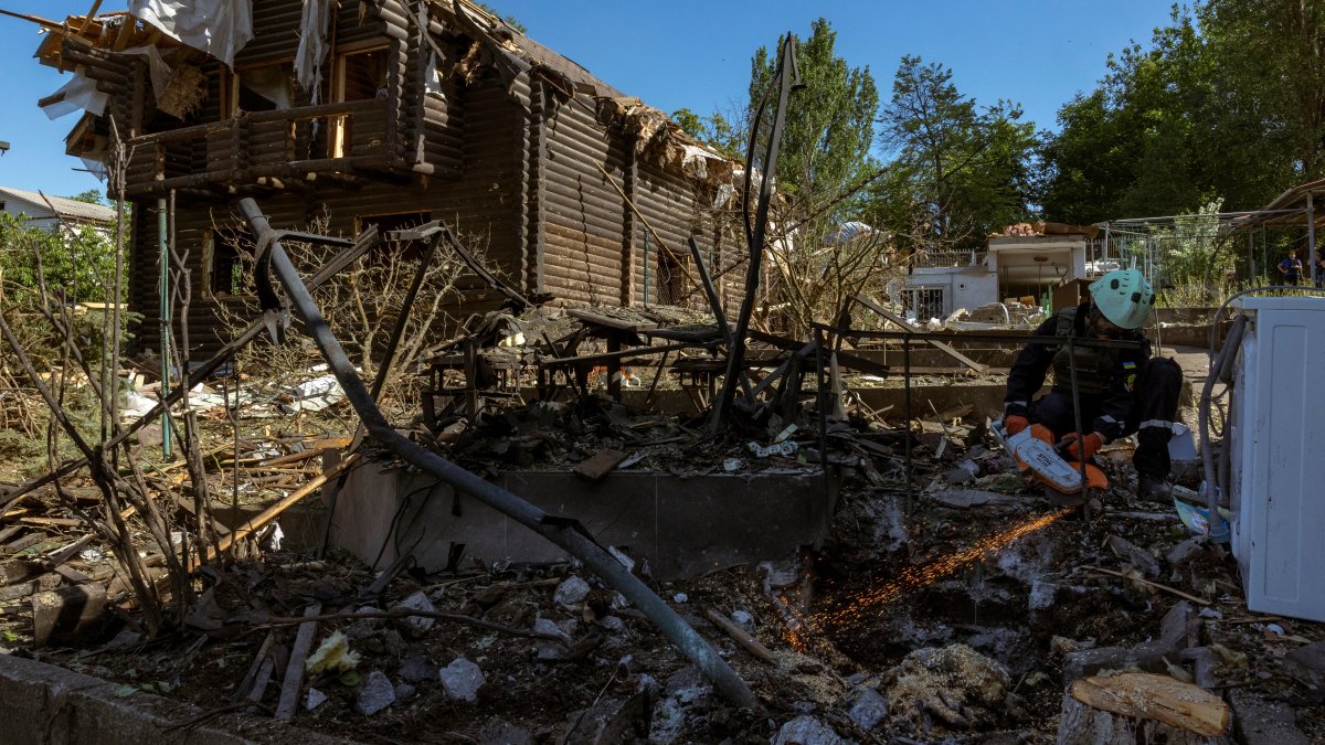 An emergency service member works at the site where Russian drones damaged several private houses, amid Russia&#039;s attack on Ukraine, Zaporizhzhia, Ukraine, June 1, 2025. (Reuters Photo)