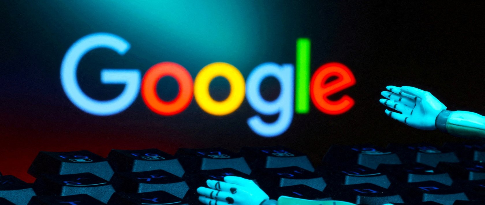 The Google logo, a keyboard and robot hands are seen in this illustration taken Jan. 27, 2025. (Reuters Photo)