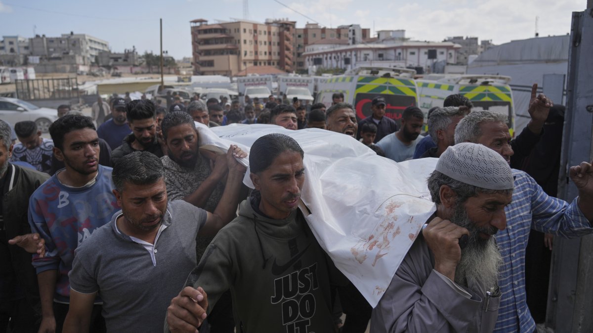 People carry the body of Reem Al-Akhras, who was killed by Israel while heading to a Gaza aid hub, during her funeral, Khan Younis, Gaza Strip, Palestine, June 3, 2025. (AP Photo)