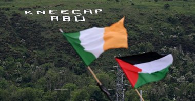 An Irish national flag can be seen alongside a Palestinian national flag as a message supporting Kneecap on Belfast's Black Mountain, Belfast, Northern Ireland, May 23, 2025. (Getty Images Photo)