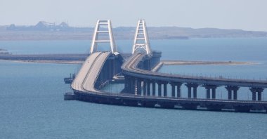 A view shows the Crimean Bridge, a section of which was damaged by an alleged overnight attack, as seen from the city of Kerch, Crimea, Ukraine, July 17, 2023. (Reuters Photo)