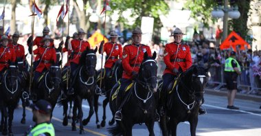 Royal Canadian Mounted Police (RCMP) officers on horseback ride towards the Senate of Canada  Building on the day of Britain&#039;s King Charles&#039;s visit, in Ottawa, Ontario, Canada May 27, 2025.  (Reuters File Photo)