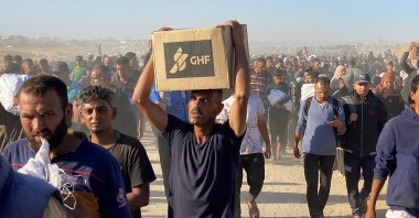 Displaced Palestinians carrying relief supplies from the Gaza Humanitarian Foundation (GHF) in Rafah, southern Gaza Strip, Palestine, May 29, 2025. (AFP Photo)