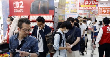 Customers line up before purchasing the new Nintendo Switch 2 gaming console at a consumer electronics retailer, Tokyo, Japan, June 5, 2025. (EPA Photo)