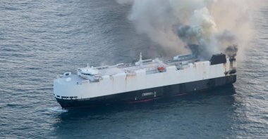 Smoke rises from a fire aboard the cargo vessel Morning Midas, carrying around 3,000 vehicles, including 800 electric vehicles, Adak, Alaska, U.S., June 3, 2025.