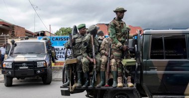 Members of the M23 rebel group mount their vehicles after the opening ceremony of Caisse Generale d&#039;epargne du Congo in Goma, North Kivu province in the East of the Democratic Republic of Congo, April 7, 2025. (Reuters File Photo)