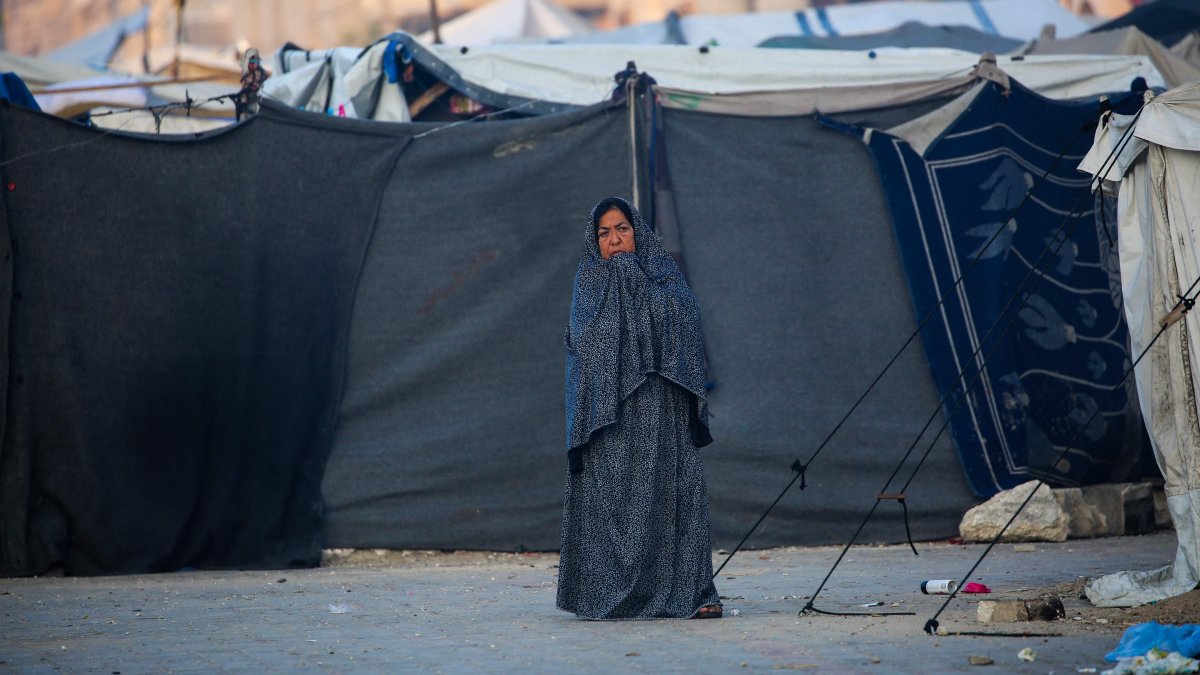 A Palestinian woman stands in front of tents for displaced people on the first day of the Muslim Eid al-Adha festival, Nuseirat, Gaza Strip, Palestine, June 6, 2025. (AFP Photo)