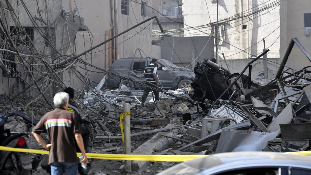 People inspect a damaged building following an Israeli airstrike in the Dahieh district, Beirut, Lebanon, June 6, 2025. (EPA Photo)