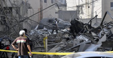People inspect a damaged building following an Israeli airstrike in the Dahieh district, Beirut, Lebanon, June 6, 2025. (EPA Photo)