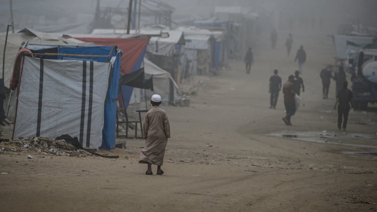 An internally displaced Palestinian boy walks to attend Eid al-Adha prayer in Gaza City, June 6, 2025. (EPA Photo)
