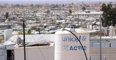 Corrugated iron huts and a water tank labeled UNICEF stand in the Jordanian refugee camp Saatari, bordering Syria, Saatari, Jordan,27 March 2025. (Getty Images Photo) 
