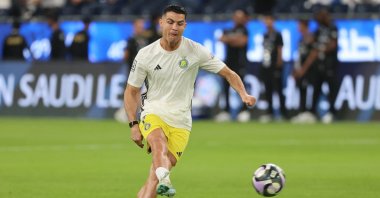 (FILES) Nassr's Portuguese forward #7 Cristiano Ronaldo shoots as he warms up ahead of the Saudi Pro League football match between Al-Hilal and Al-Nassr at the Kingdom Arena stadium in Riyadh on April 4, 2025. Ronaldo indicated on May 27 that he could leave Al Nassr after declaring that a "chapter is over" hours after the Saudi Pro League finished. (Photo by Fayez NURELDINE / AFP)