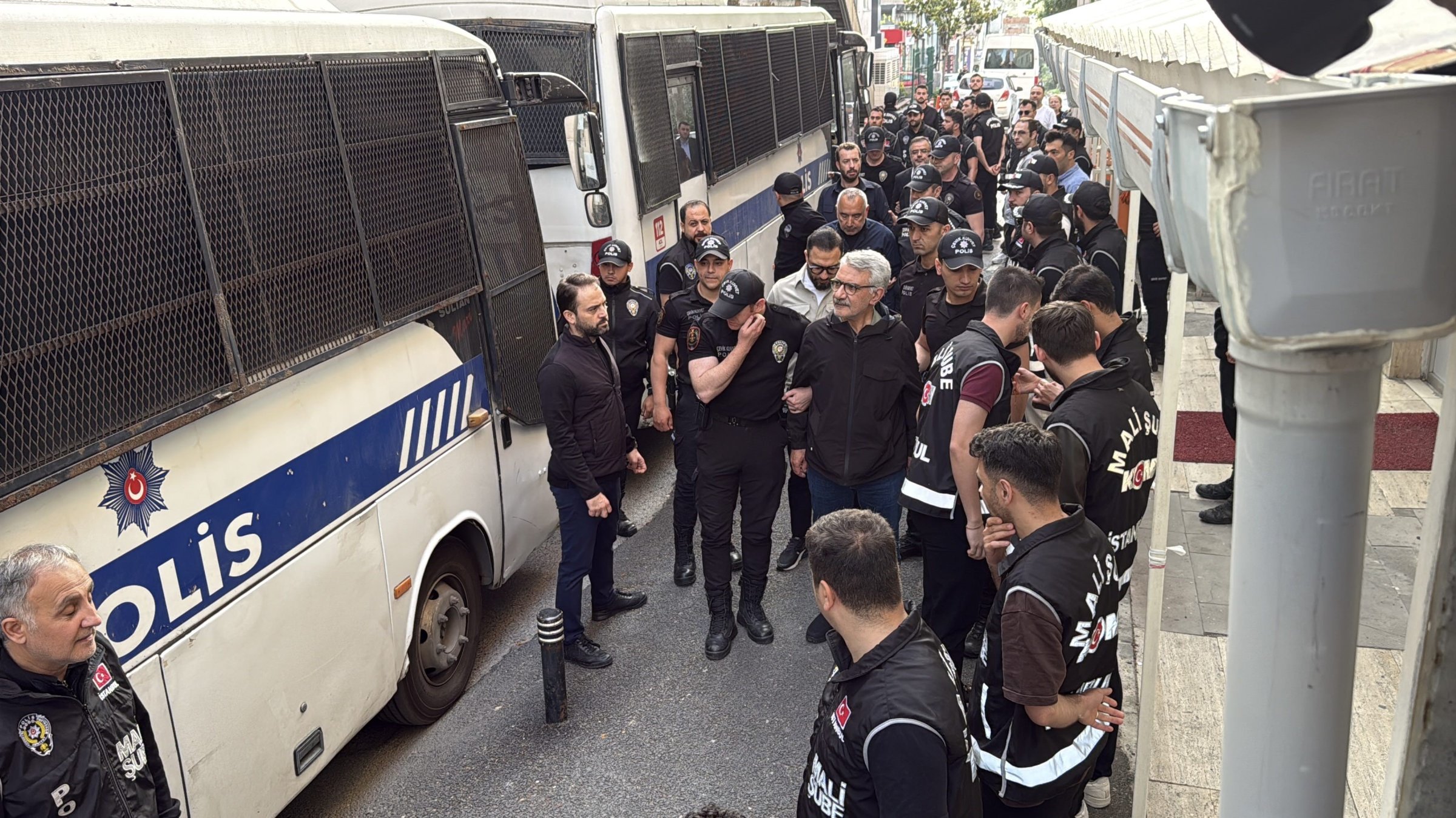 Police officers escort suspects detained in an investigation into corruption at Istanbul municipalities, Istanbul, Türkiye, Jun. 3, 2025. (İHA Photo)