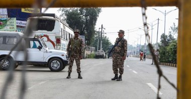 Security personnel stand guard at a checkpoint after a curfew was imposed following recent violence in Imphal, Manipur state, India, June 8, 2025. (AFP Photo)