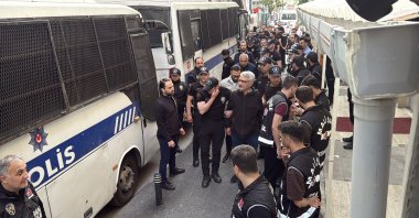 Police officers escort suspects detained in an investigation into corruption at Istanbul municipalities, Istanbul, Türkiye, Jun. 3, 2025. (İHA Photo)