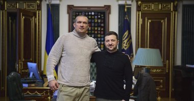 Ukrainian President Volodymyr Zelenskyy (R) and Ukraine&#039;s boxer Oleksandr Usyk pose for a photo in the Presidential Office, Kyiv, Ukraine, Dec. 31, 2024. (AP Photo)