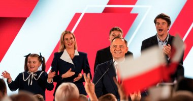 Polish President Karol Nawrocki, backed by the main opposition Law and Justice (PiS) party, looks on next to his wife Marta Nawrocka, his sons Antoni and Daniel and daughter Katarzyna, as they react to the exit polls of the second round of the presidential election, Warsaw, Poland, June 1, 2025. (Reuters Photo)