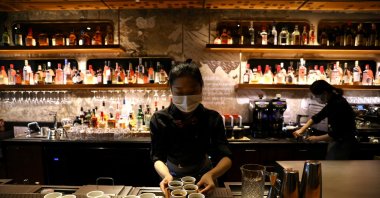 A barista serves coffee at a Starbucks flagship store, Beijing, China, Jan. 18, 2022. (Reuters Photo)