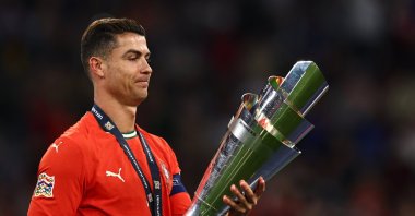 Portugal&#039;s Cristiano Ronaldo looks at the trophy after the UEFA Nations League final match between Portugal and Spain, Munich, Germany, June 8, 2025. (EPA Photo)