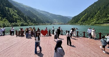 People are photographed in a popular area of Uzungöl, Trabzon, northern Türkiye, June 9, 2025. (AA Photo)