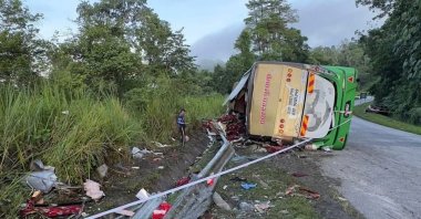 Emergency crew work at the site of a bus crash on the East-West Highway near the town of Gerik, Malaysia, June 9, 2025. (DHA Photo)