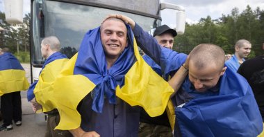 Ukrainian prisoners of war celebrate their return following a prisoner swap with Russia, at an undisclosed location, Ukraine, June 9, 2025. (EPA Photo)