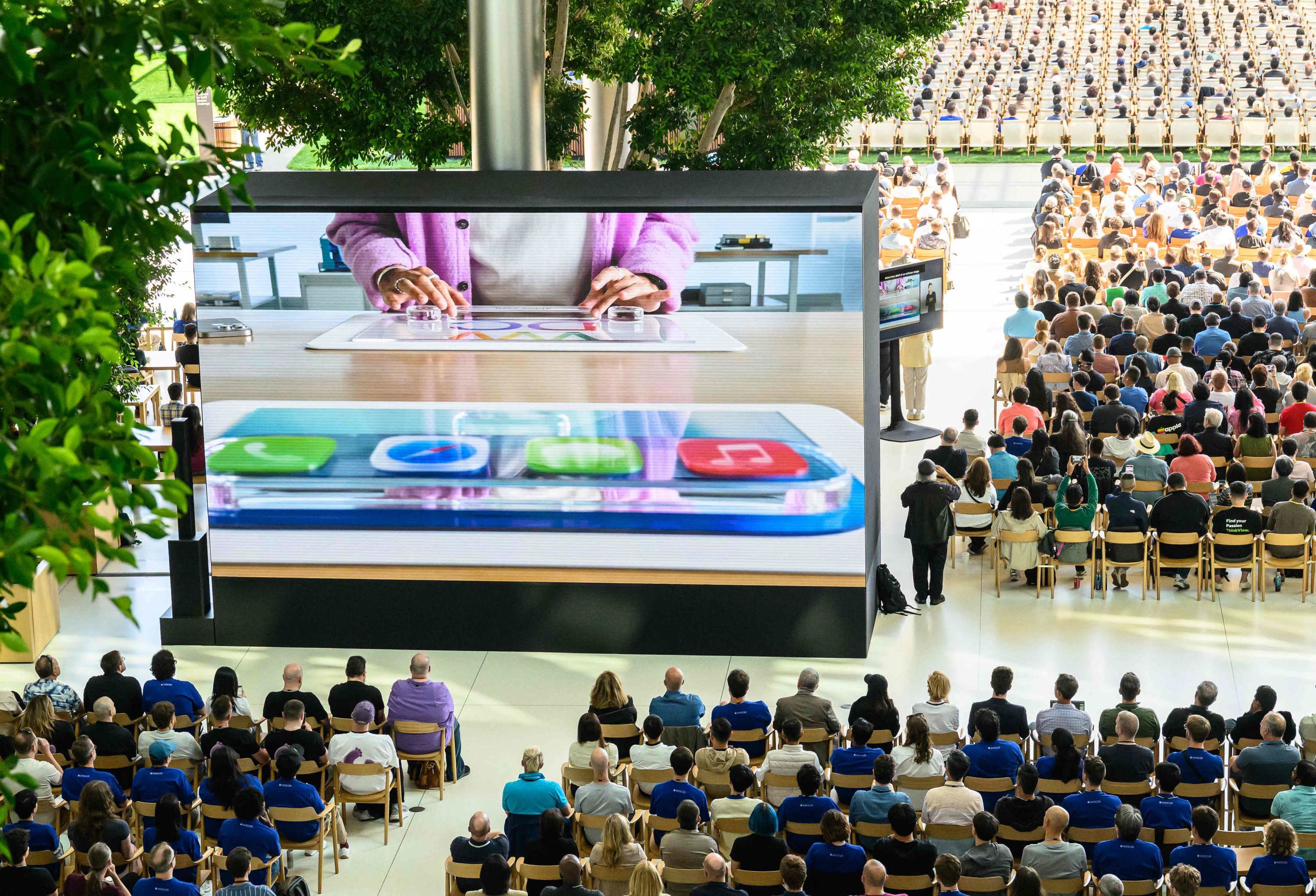 Attendees watch a presentation during Apple's annual Worldwide Developers Conference (WWDC) at its headquarters, Cupertino, California, U.S., June 9, 2025. (AFP Photo)