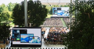 People listen as Apple releases its new software design, Liquid Glass, during its annual Worldwide Developers Conference (WWDC) at its headquarters, Cupertino, California, U.S., June 9, 2025. (Reuters Photo)