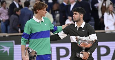Spain&#039;s Carlos Alcaraz (R) celebrates with the Coupe des Mousquetaires after winning his Men&#039;s final match against Italy&#039;s Jannik Sinner with his runner-up trophy at the French Open Grand Slam tennis tournament at Roland Garros, Paris, France, June 2025. (AA Photo)