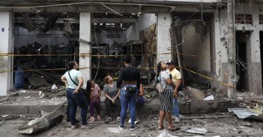 Colombians look at the damage from a car bomb in Corinto, Colombia, June 10, 2025. (EPA Photo)